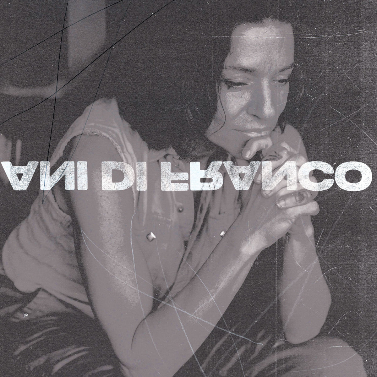 Ani Difranco – Unprecedented Sh!T (Coke Bottle Clear Vinyl) (Indies) (Coloured Vinyl) vinyl record cover