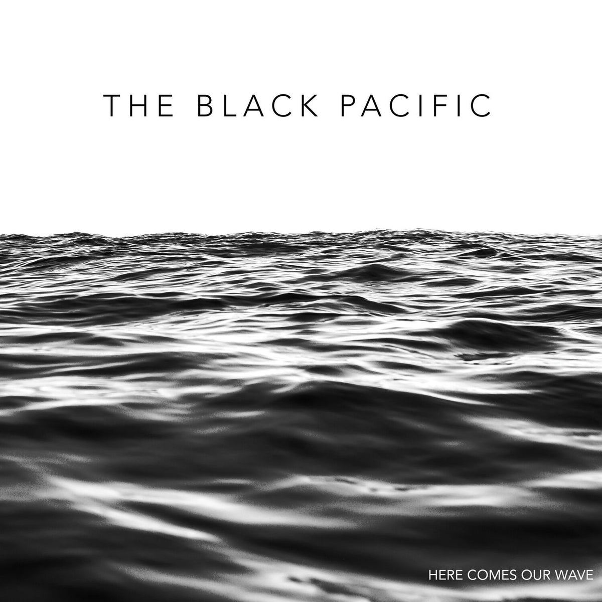 The Black Pacific – Here Comes Our Wave (Clear With Black & White Splatter LP) by Black Pacific,The vinyl record cover
