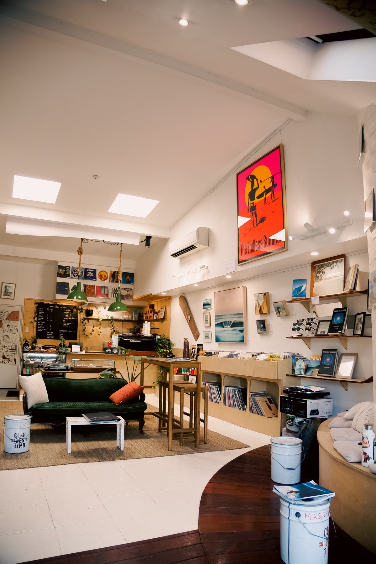The large framed Endless Summer poster above the record bins and lounge at Noosa Records